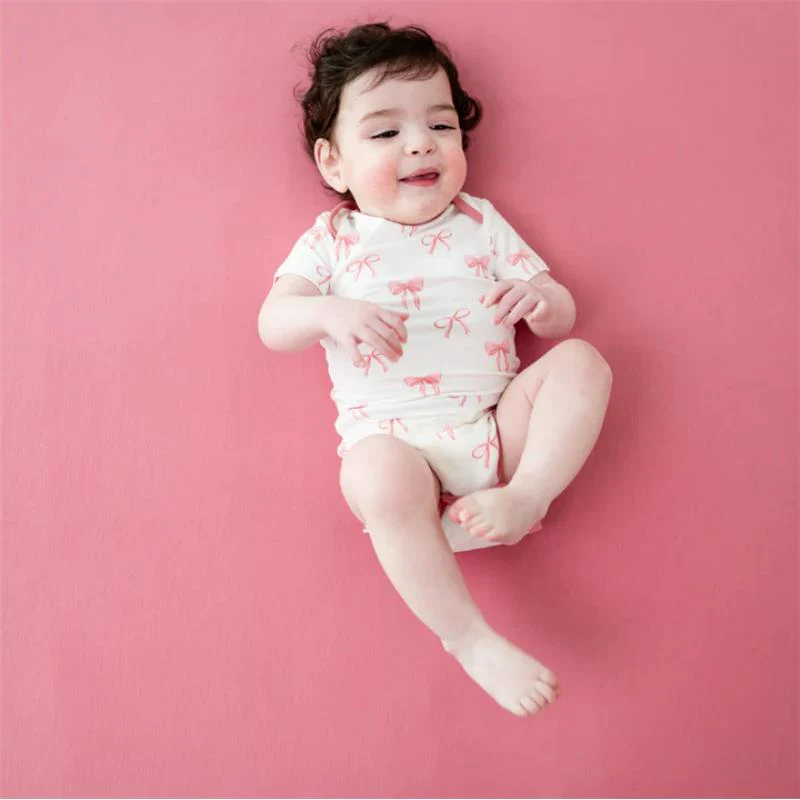 Kyte Baby Bodysuit In Bow - Image 3
